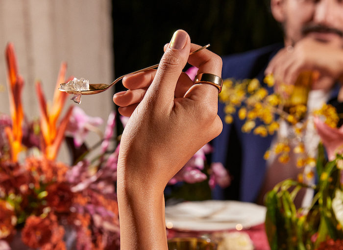 Person eating dinner wearing an Oura Ring