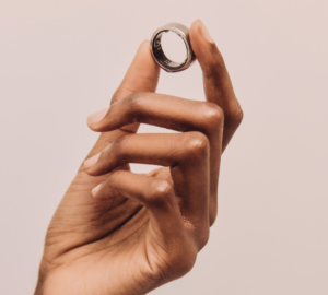 Hand holding Oura Ring
