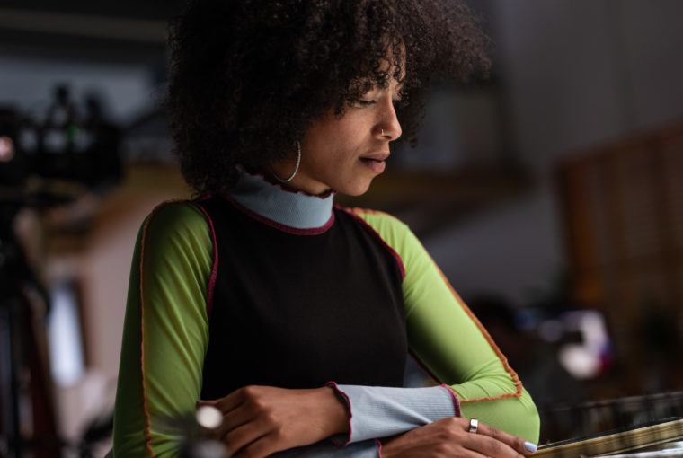 Woman working at desk wearing Oura Ring