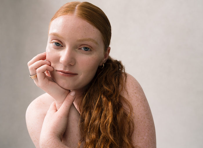 Redhaired Woman Wearing Oura Ring