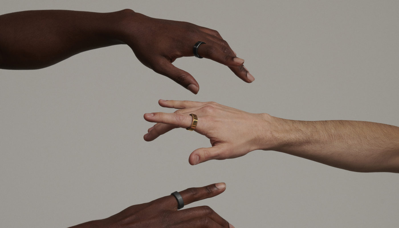 hands wearing oura ring