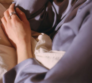 Woman Sleeping with Oura Ring