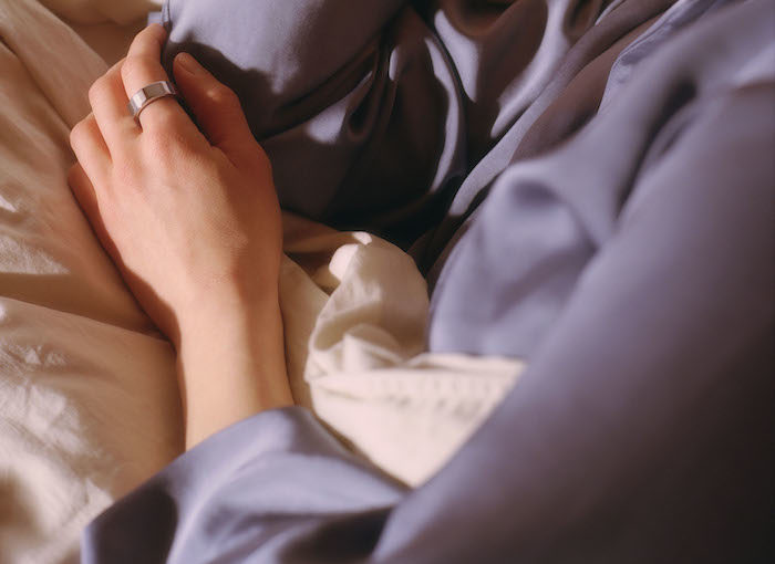Woman Sleeping with Oura Ring