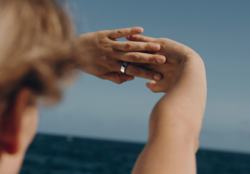 Woman wearing Oura Ring with hands outstretched