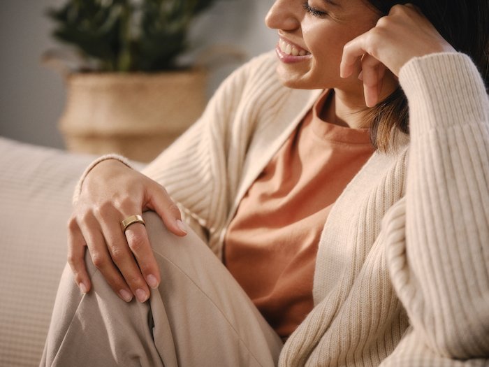 Woman relaxing wearing an Oura Ring