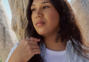 A woman wearing her Oura Ring to track her stress