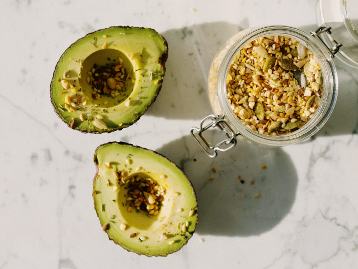 Avocado topped with seeds