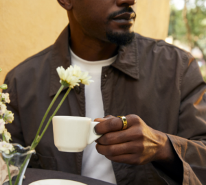 Man Wearing Oura Ring Drinking Coffee