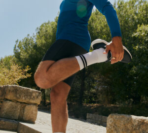 Man stretching before a run wearing Oura Ring