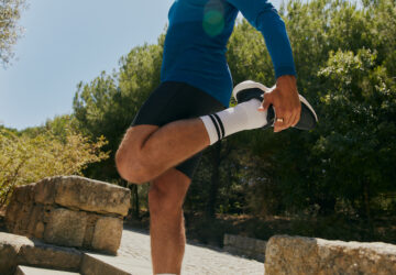 Man stretching before a run wearing Oura Ring