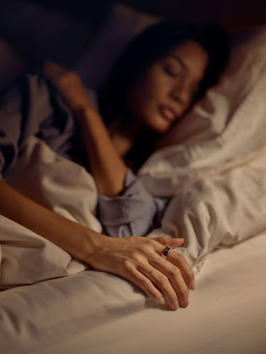 Woman sleeping wearing Oura Ring