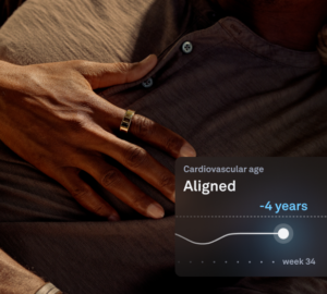 Oura Ring Cardiovascular Age | Man lying down with hand on chest