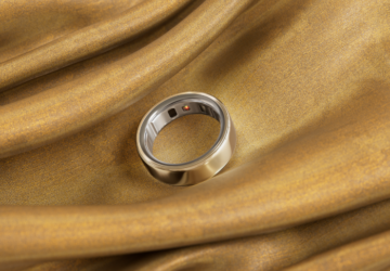 Gold Oura Ring 4 on gold fabric