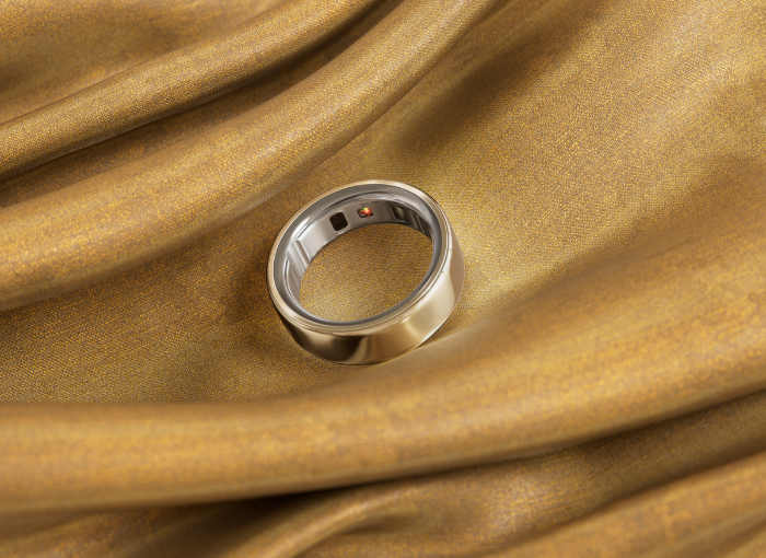 Gold Oura Ring 4 on gold fabric