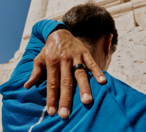 Man wearing Oura Ring and blue shirt