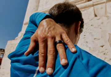 Man wearing Oura Ring and blue shirt