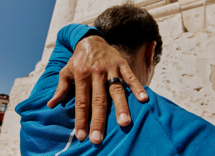 Man wearing Oura Ring and blue shirt