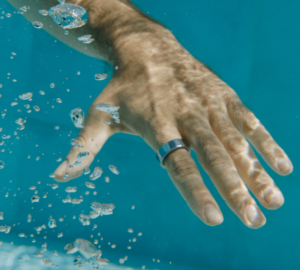 Man wearing Oura Ring in water