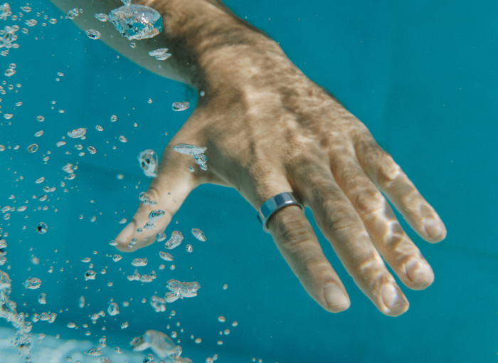 Man wearing Oura Ring in water