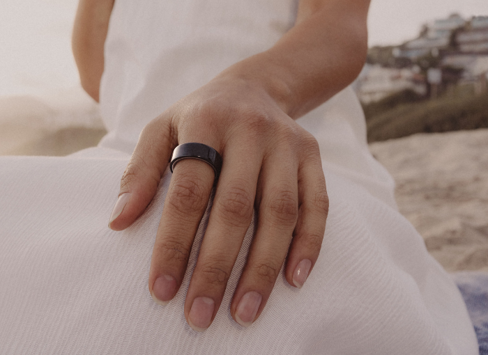 Woman wearing black Oura Ring