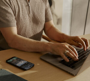 Man wearing Oura Ring and typing on computer