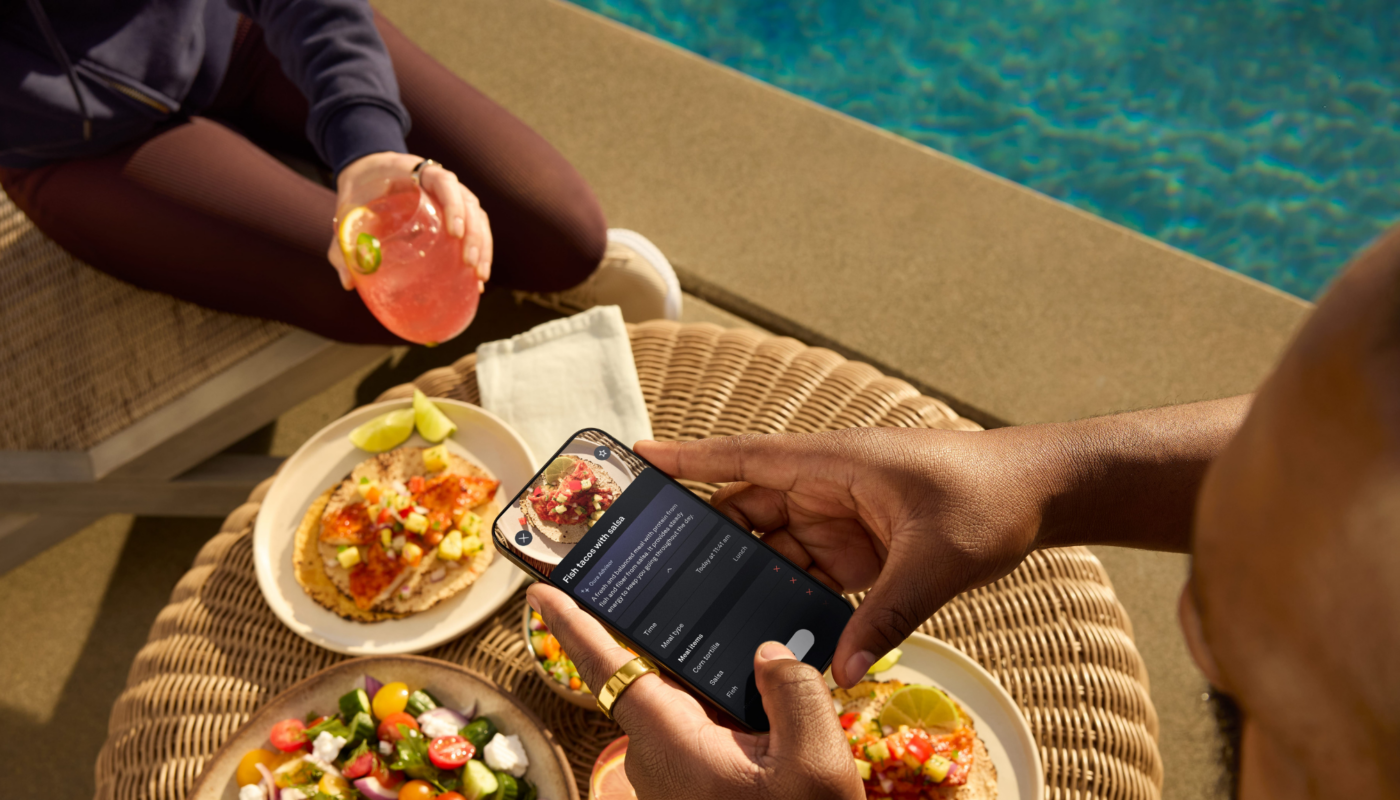 Man wearing Oura Ring taking a picture of food