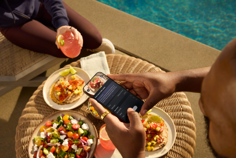 Man wearing Oura Ring taking a picture of food