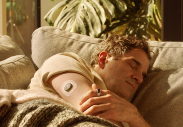 Man sleeping wearing Oura Ring + Stelo Glucose Biosensor