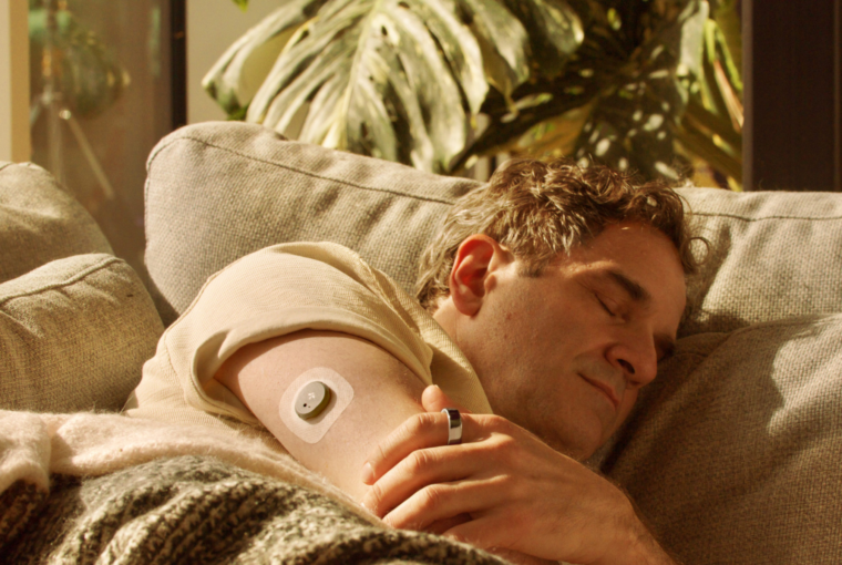 Man sleeping wearing Oura Ring + Stelo Glucose Biosensor
