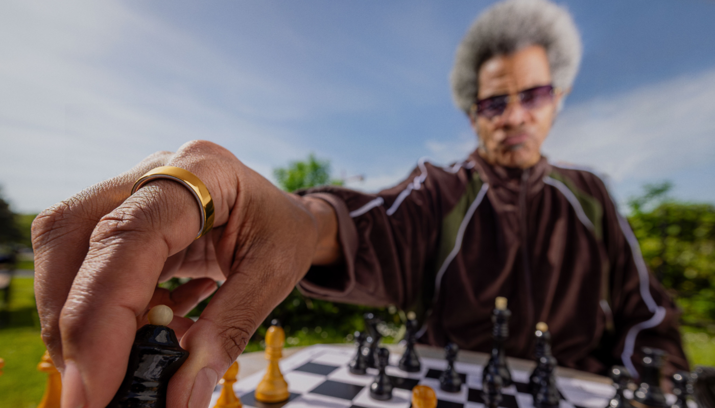 Person wearing chess wearing Oura Ring