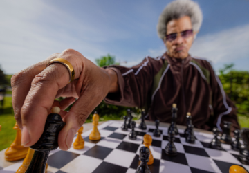 Person wearing chess wearing Oura Ring