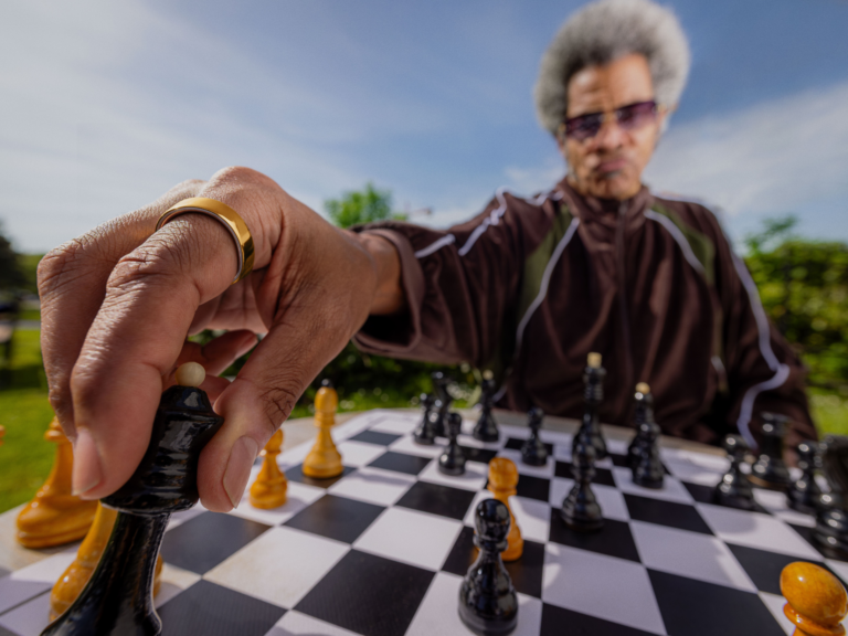 Person wearing chess wearing Oura Ring