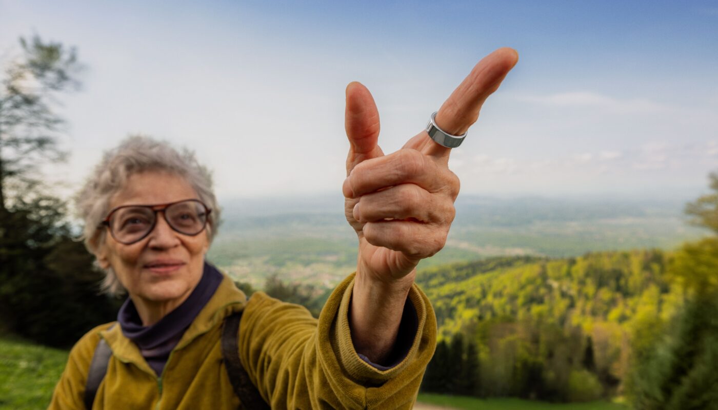 Woman hiking wearing Oura Ring