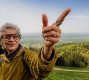 Woman hiking wearing Oura Ring
