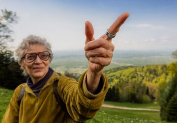 Woman hiking wearing Oura Ring