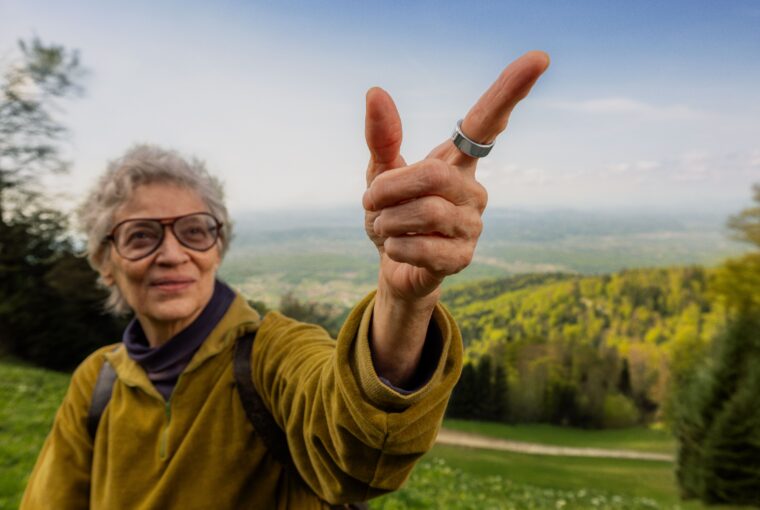 Woman hiking wearing Oura Ring