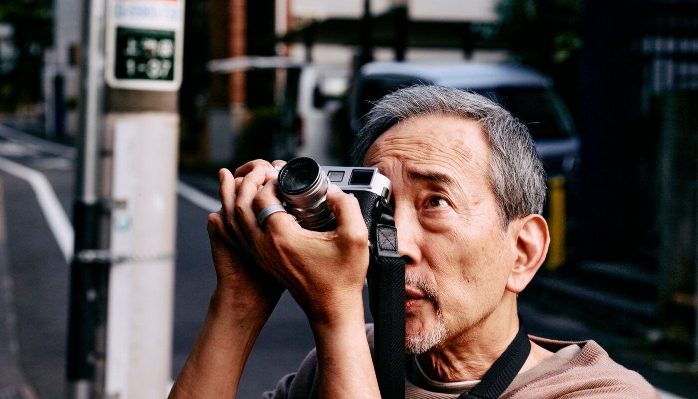 Man taking photograph wearing Oura Ring