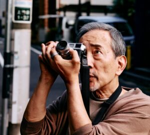 Man taking photograph wearing Oura Ring