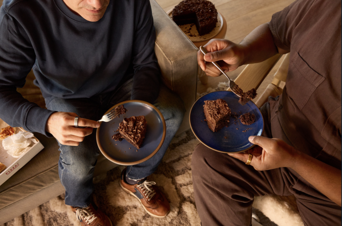People eating chocolate cake wearing Oura Ring