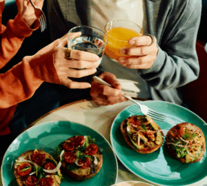 Women sharing a meal together wearing Oura Ring