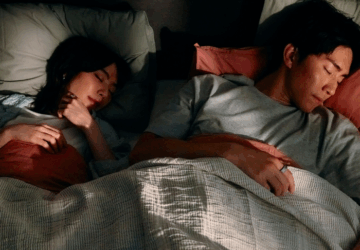 Couple sleeping wearing Oura Ring