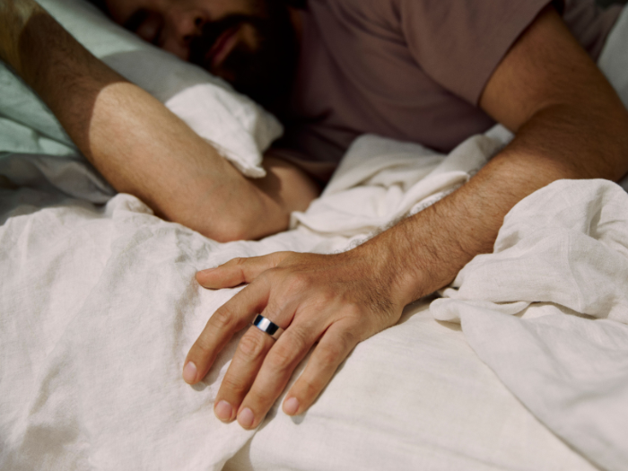 Person sleeping wearing Oura Ring 4
