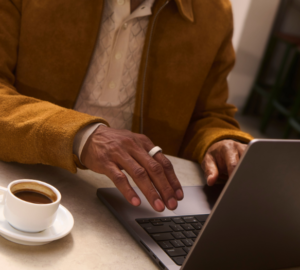 Man working on laptop wearing Oura Ring