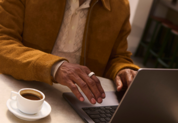 Man working on laptop wearing Oura Ring
