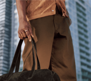Businessman wearing Oura Ring 5 and carrying bag