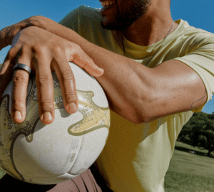 Man wearing Oura Ring 4 holding soccer ball