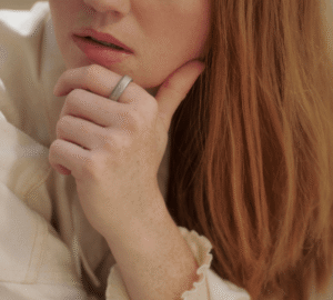 Woman with red hair wearing Oura Ring 5