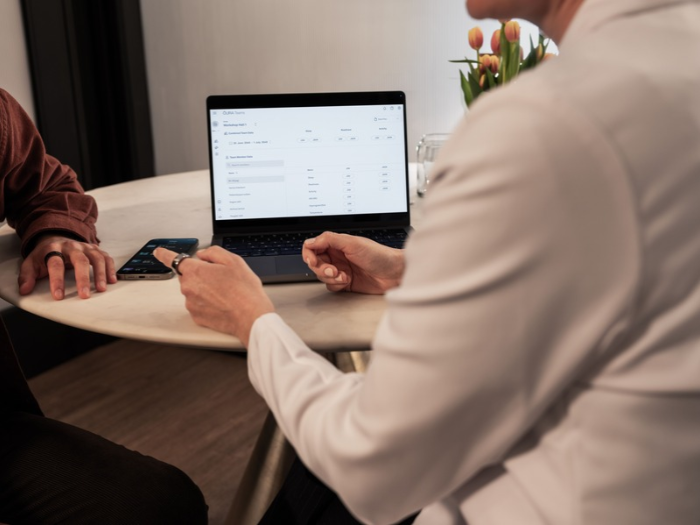 Doctor and patient talking at computer wearing Oura Ring