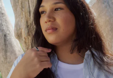 A woman wearing her Oura Ring to track her stress