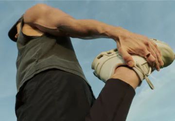 A man using his Oura ring to track his fitness